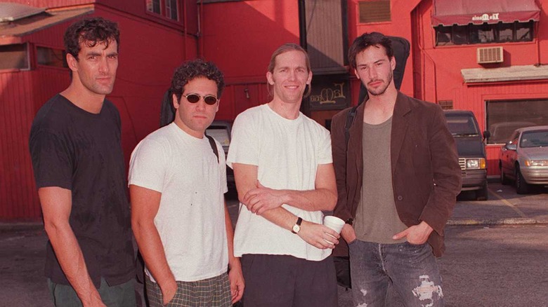 keanu posing outside of speed movie