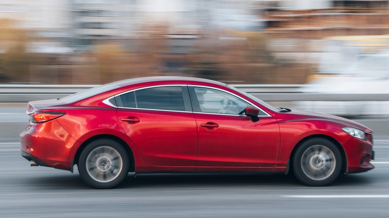 Mazda 6 driving on road