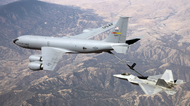 Aerial view of USAF KC-135 tanker refueling F-35 fighter.