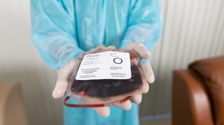 Person holding bag of Type O blood.