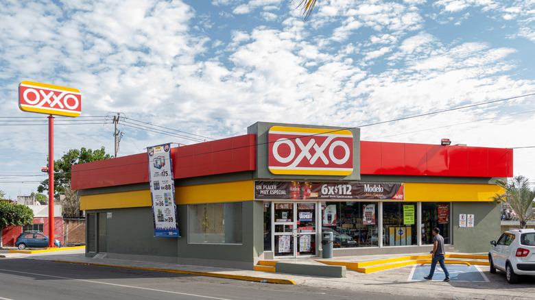 OXXO convenience store on sunny day with clouds in sky