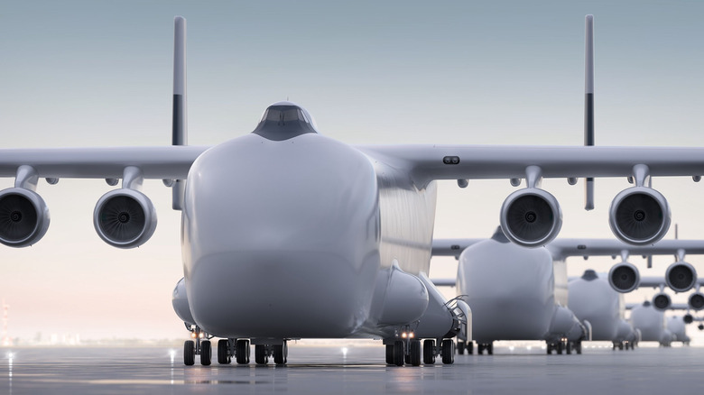 A render of five white WindRunners at an airport at dawn