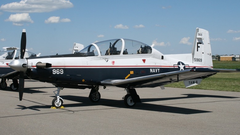 A Navy T-6 Texan II parked on a tarmac