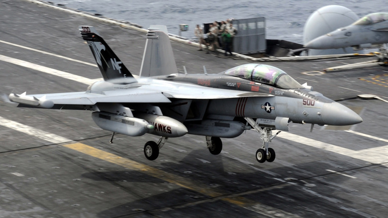 F/A-18 Super Hornet landing on an aircraft carrier flight deck