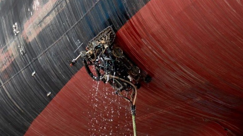A hull technician working on the USS Charleston