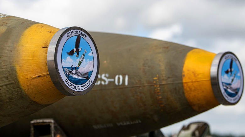 Two GBU-31 Joint Direct Attack Munitions are prepared for loading