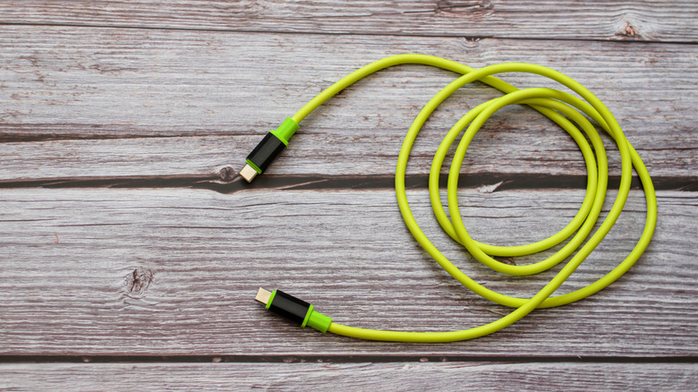 A USB-C to USB-C cable on a wooden background