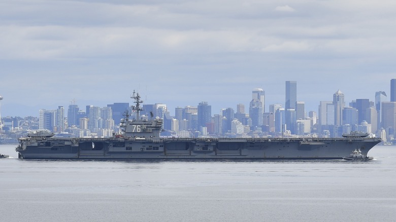 The USS Ronald Reagan pulling into Puget Sound toward its home base.