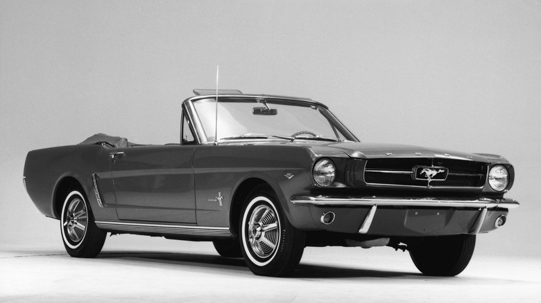 Front-quarter press image of a 1964 Ford Mustang Convertible