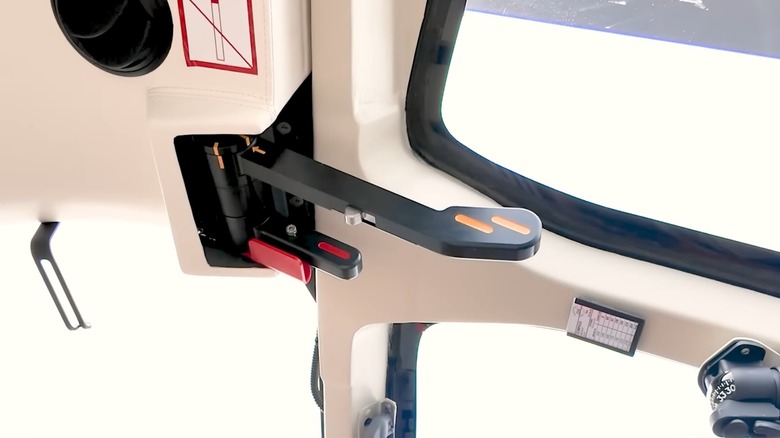 Rotor brake lever inside helicopter.