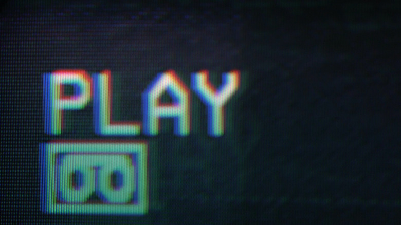 VCR screen reading "Play"