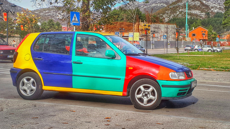 1996 VW Golf Harlequin parked on a European street.