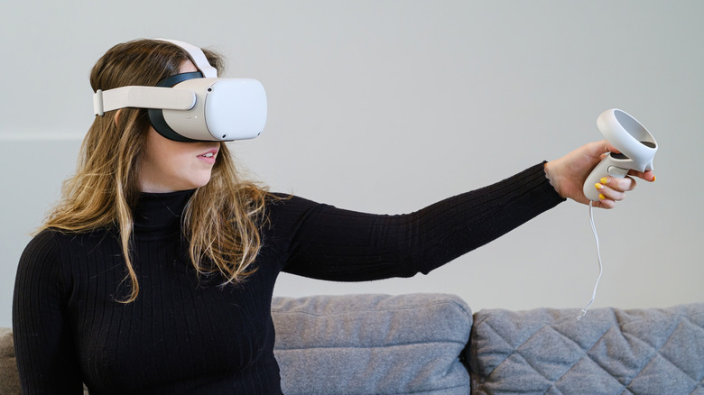 Young woman uses a Meta Quest 2 VR headset