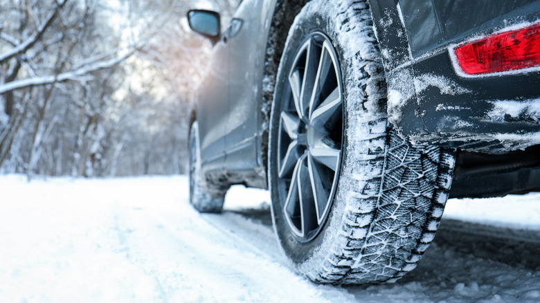 Car driving in snow with winter tires