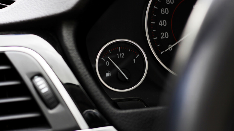 A fuel gauge in a modern BMW showing relatively low fuel