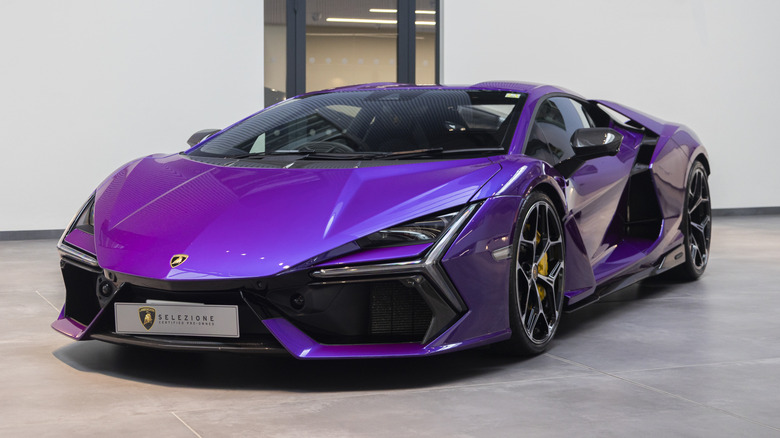 A metallic purple Lamborghini Revuelto parked in a showroom.