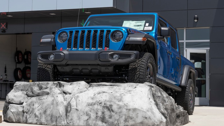 A Jeep Wrangler outside a Stellantis dealership.