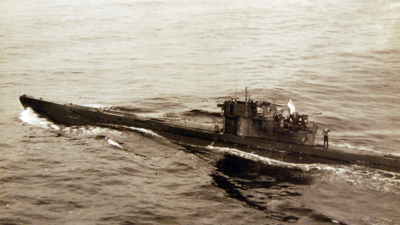 U-249, a German Type VIIC submarine, flying a white flag and surrendering