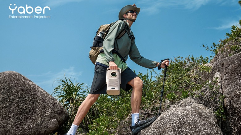 Hiker carrying Yaber projector