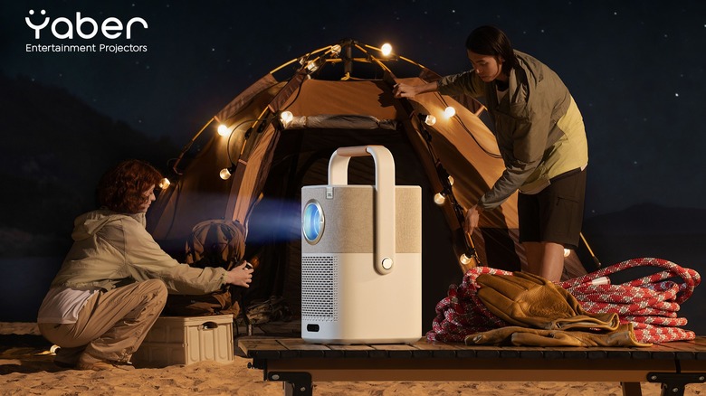 Yaber projector turned on in front of beach tent