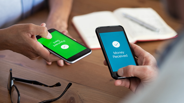 People transferring money via phone