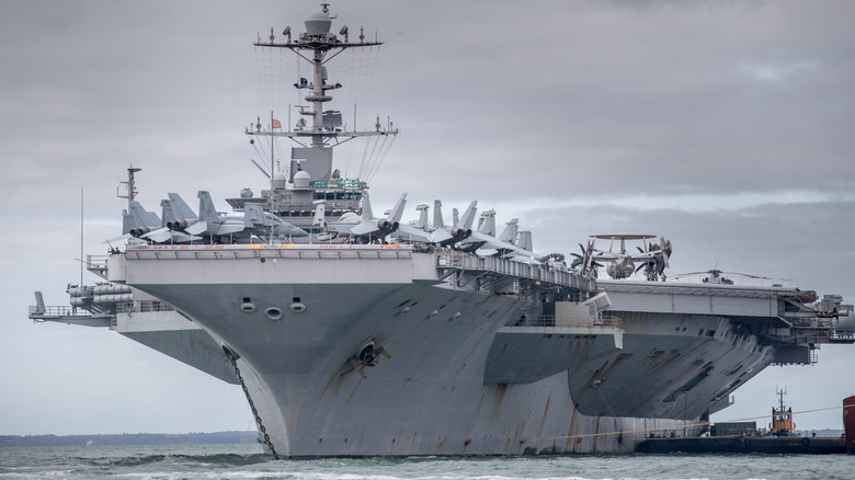 Front view of aircraft carrier USS Harry Truman at port.