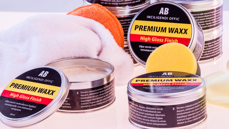 An image showing several cans of automotive wax