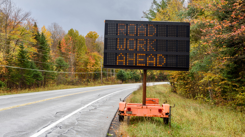 "Road Work Ahead" sign on a country road