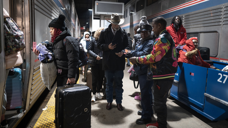 Passengers board an Amtrak train in Chicago.