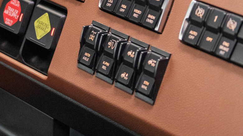 Close shot of truck dashboard with inter-axle power divider switch shown