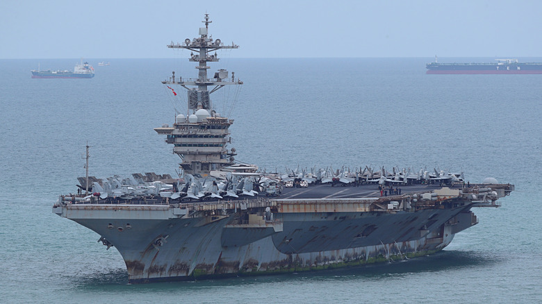 The USS Abraham Lincoln showing signs of rust and overall wear in 2026.