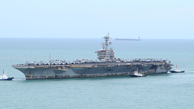 USS Abraham Lincoln pulling into port in 2026