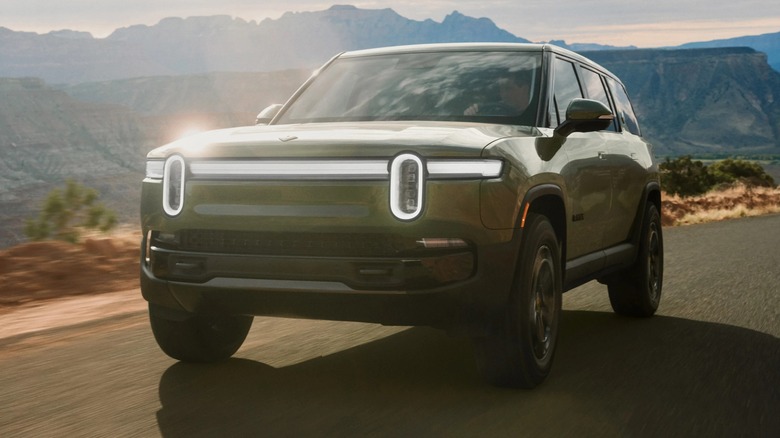 Rivian driving along desert highway