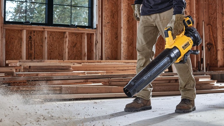 Person using DeWalt leaf blower