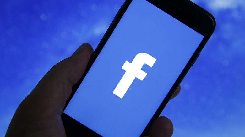 Facebook logo on an iPhone screen