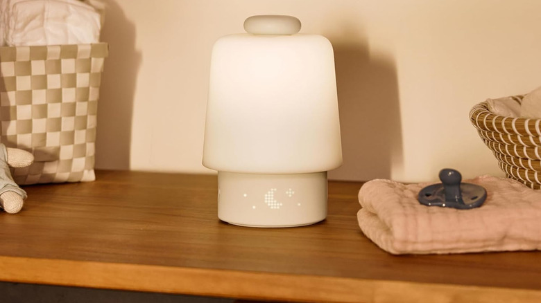 Hatch Baby sound machine with night light on a wooden table