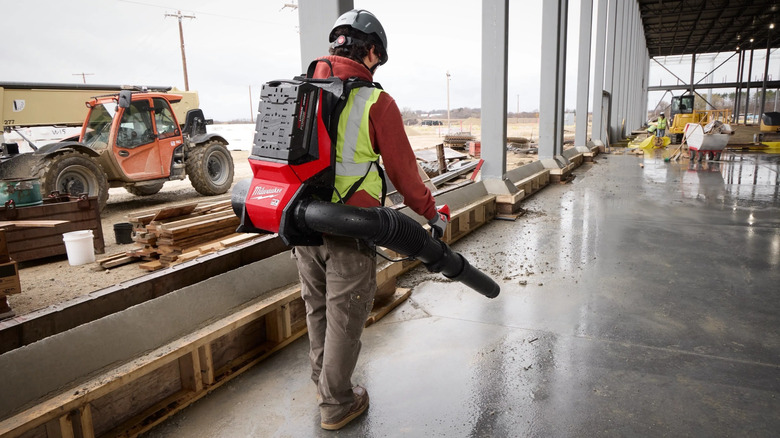 Person using Milwaukee leaf blower
