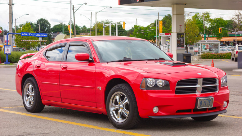 A red 2006 Dodge Charger driving