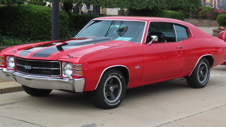 Red and black 1971 Chevrolet Chevelle SS parked at a roadside