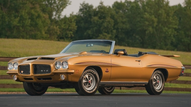Bronze 1971 Pontiac GTO Judge convertible parked on a rural road