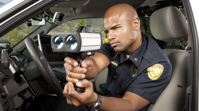 Police officer with radar gun