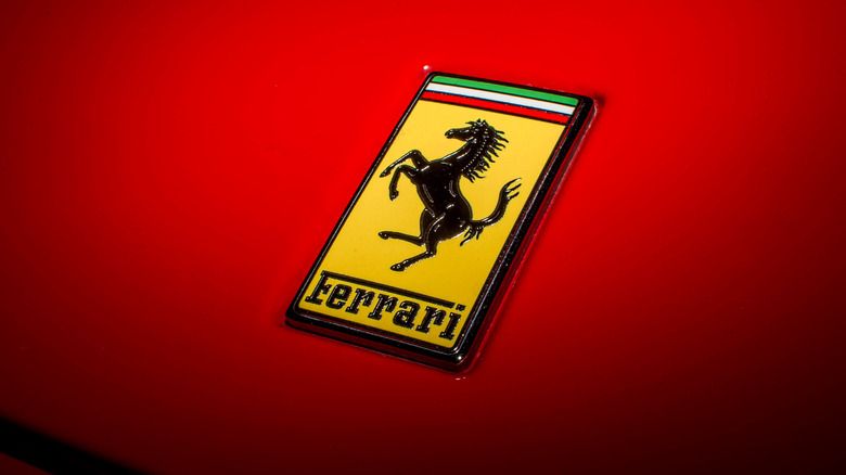 Ferrari Prancing Horse logo on red car