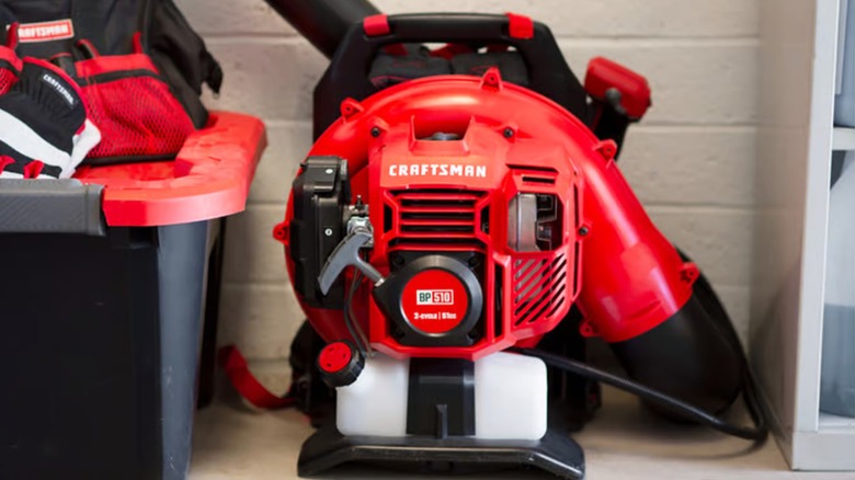 A Craftsman backpack blower in a garage.