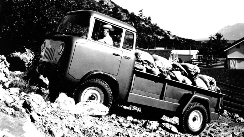 Jeep Forward Control driving up a hill