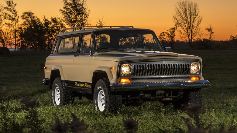 SJ Jeep Cherokee parked in a field