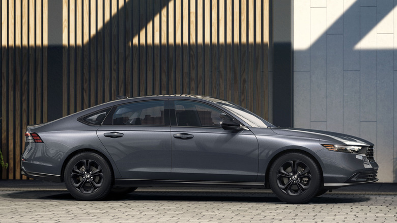 Side view of gray 2025 Honda Accord SE parked in front of building.