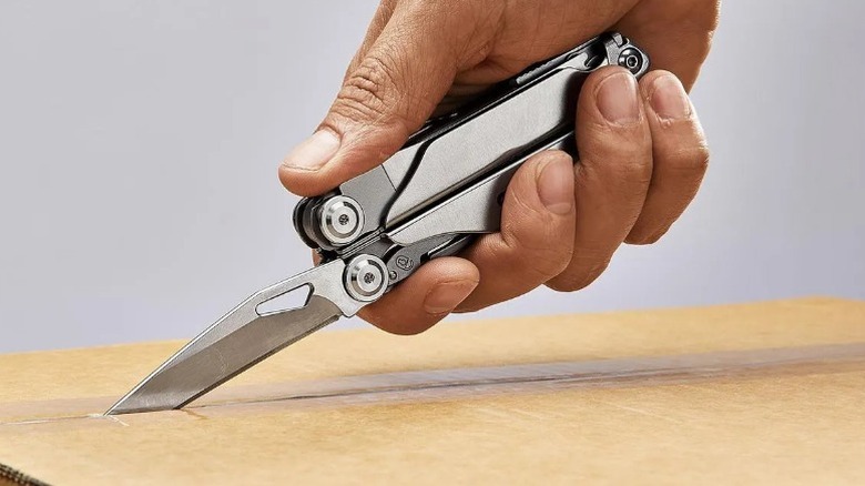 Person opening box with a Gordon 20-in-1