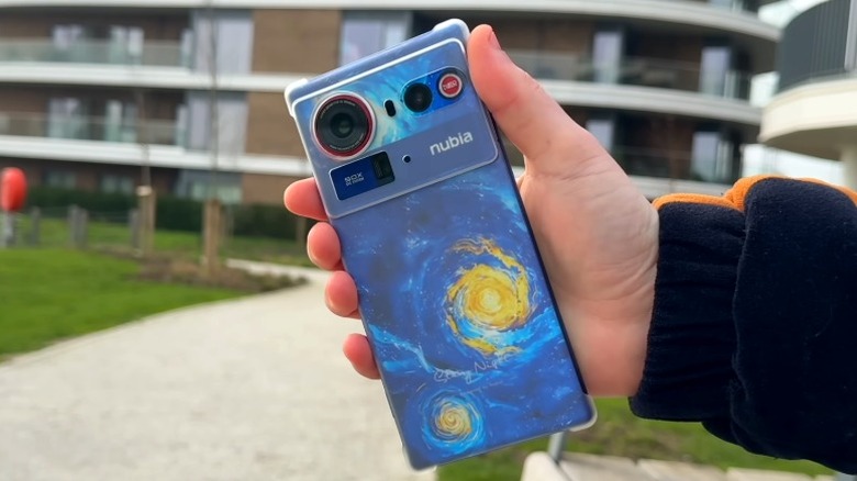 Hand holding a Nubia Z80 Ultra outdoors