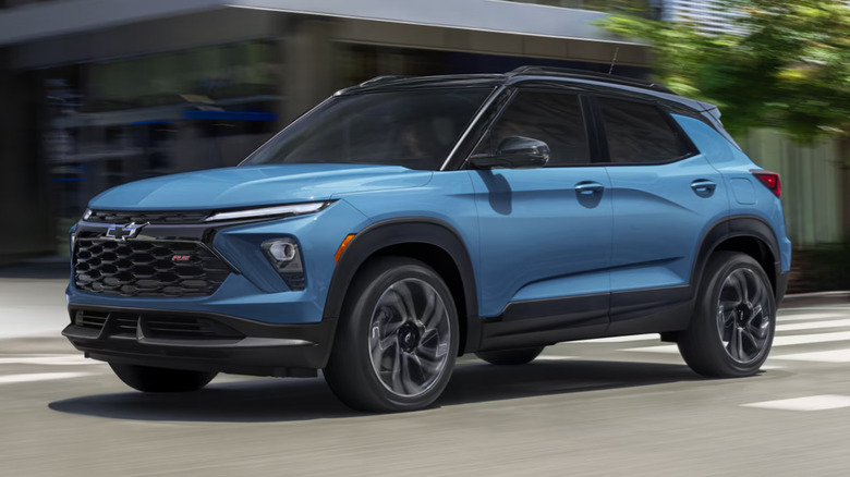 A blue 2026 Chevrolet Trailblazer driving through a city