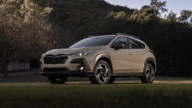 A light gray 2026 Subaru Crosstrek parked on grass